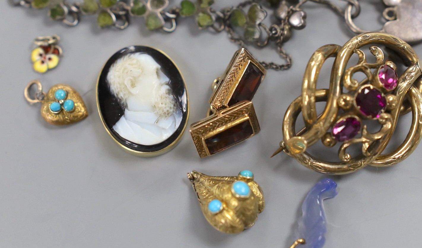 A small group of Victorian and later jewellery including a 1920's silver 'shamrock' bracelet, garnet set scroll brooch, bloodstone set mourning pendant(lacking back), small charms including enamel, sardonyx cameo etc.